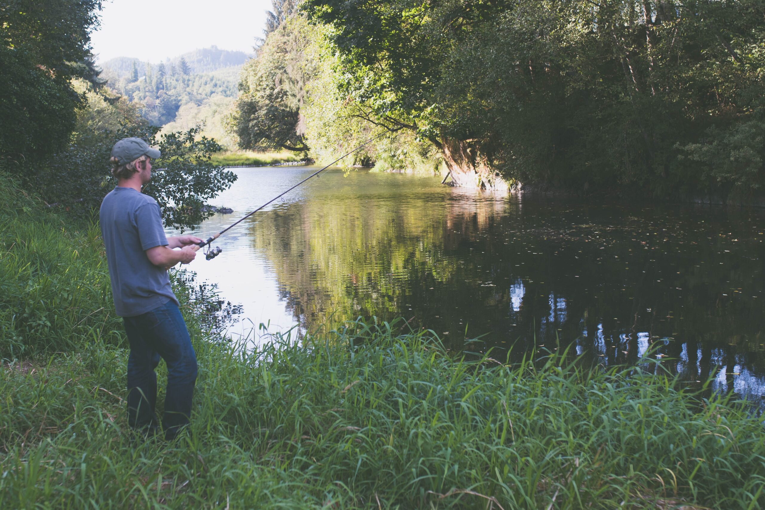 Person Coarse fishing on a river
